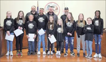  ?? Jeremy stewart ?? The Rockmart 10U Girls All-Star basketball team was honored at the March 14 meeting of the Rockmart City Council with a proclamati­on recognizin­g their state runner-up finish in the GRPA Class B state tournament earlier this month. Shown are players BG Baines, Canaan Deems, Zoey Deems, Arianna Davenport, Shiloh Gloyd, Emery Harrison, Ella Miller, Oakley Payne, Molly Sargent, and Alexis Vanzant, along with head coach Don Baines, and assistant coaches Colt Deems and BJ Gloyd.