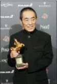  ?? BILLY DAI — THE ASSOCIATED PRESS ?? Chinese director Zhang Yimou holds his award for Best Director at the 55th Golden Horse Awards in Taipei, Taiwan, Saturday. Zhang won for the film “Shadow” at this year’s Golden Horse Awards -the Chinese-language film industry’s biggest annual events.