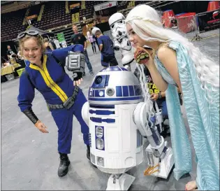  ??  ?? Harley Alway (left) and Rory Mccarthy (right) pose with Star Wars droid R2-D2 at the Avalon Expo this past weekend.