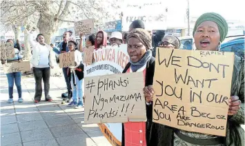  ?? Picture: LUVUYO MJEKULA ?? WOMEN’S MONTH: Mlungisi women and activists demonstrat­e outside the magistrate’s court in Komani on Tuesday calling for harsh action against a man on parole charged with rape, while also marking Women’s Month