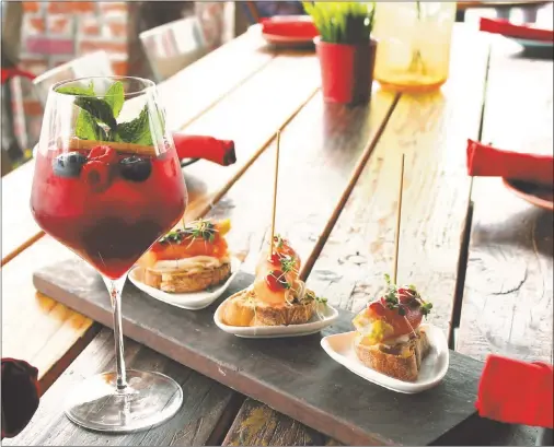  ?? COURTESY OF YURI CHAUCA ?? Pair the signature Teleferic Barcelona Sangria with smoked salmon and mascarpone tapas at the Spanish-themed downtown Walnut Creek restaurant.