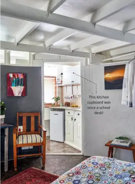  ??  ?? This kitchen cupboard was once a school desk! The exposed joists supporting the roof enhance the impression that the roof is floating on top of the old reservoir. The bathroom is accessed through the kitchen.