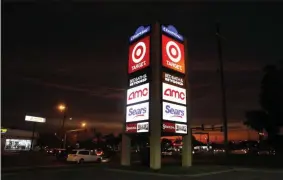  ?? GERALD HERBERT ?? FILE - This Aug. 15, 2019, file photo shows signage for Target, Bed Bath & Beyond, AMC Theaters, and Sears in Metairie, La. Nine months out of bankruptcy, Sears is limping into the holiday shopping season.