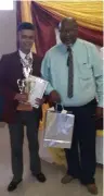  ??  ?? Valentino Saayman, who was the top learner in Grade 12, with principal Webb.