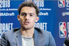  ?? MARY ALTAFFER/ THE ASSOCIATED PRESS ?? Oklahoma’s Trae Young going to Atlanta from Dallas for Luka Doncic provided most of the excitement in what was generally considered a subdued NBA draft on Thursday night.