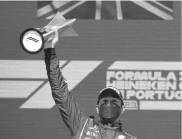  ?? FOTO AFP ?? > Lewis Hamilton celebra su triunfo.