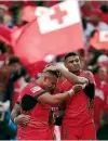  ??  ?? Daniel Tupou celebrates with his Tongan team-mates.