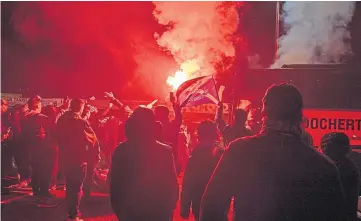  ??  ?? FLARE-UP: St Johnstone fans gather outside McDiarmid Park on Sunday evening after the Perth club’s historic victory in the League Cup final at Hampden Park.