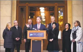  ?? Jessica Hill / Associated Press ?? Governor-elect Ned Lamont with his transition team last month at the state Capitol. From the left, wife Annie Lamont and transition team members Ryan Drajewicz, the incoming chief of staff; Attorney General George Jepsen; Garrett Moran; Lieutenant Governor-elect Susan Bysiewicz; Dr. Elsa Nunez; and State Rep. Toni Walker.