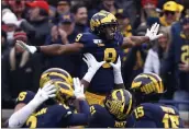  ?? PAUL SANCYA — THE ASSOCIATED PRESS FILE ?? Michigan canceled its annual rivalry game at Ohio State on Tuesday because of the COVID- 19 outbreak within the Wolverines program.