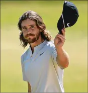  ?? MIKE EHRMANN / GETTY IMAGES ?? Englishman Tommy Fleetwood walks off the 18th green in the final round of the U.S. Open at Shinnecock Hills Golf Club after his 7-under 63.