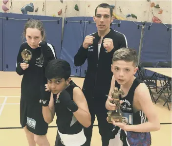  ??  ?? The Peterborou­gh Police Amatwur Boxing Club team that fought in Devon. From the left are Hannah May Anderson, Rushaan Raja, Daniel Meins and Shae Gowler.