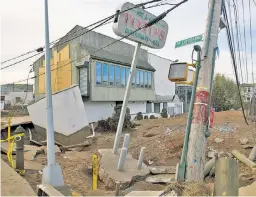  ?? ?? John Toto stands where his Staten Island home once stood after Hurricane Sandy destroyed it and his restaurant (above).