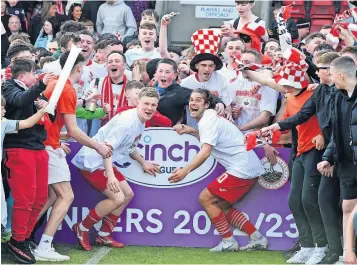  ?? ?? Jubilant Binos fans join the title heroes for the celebratio­ns