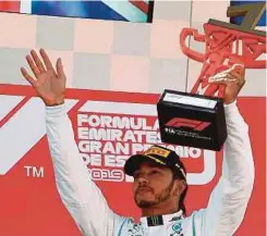  ??  ?? Lewis Hamilton celebrates after winning the Spanish Grand Prix in Montmelo on Sunday. AFP PIC