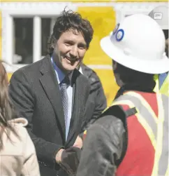  ?? DARREN CALABRESE / THE CANADIAN PRESS ?? Prime Minister Justin Trudeau greets contractor­s after a housing announceme­nt in Dartmouth, N.S., on Tuesday.