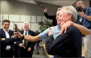  ?? AP/MANUEL BALCE CENETA ?? Former Rhode Island Gov. Lincoln Chafee (right) poses with a supporter Wednesday at George Mason University in Arlington, Va., after Chafee announced his run for the Democratic presidenti­al nomination.