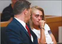  ?? Associated Press photo ?? Michelle Carter awaits her sentencing in a courtroom in Taunton, Mass., Thursday for involuntar­y manslaught­er for encouragin­g Conrad Roy III to kill himself in July 2014.