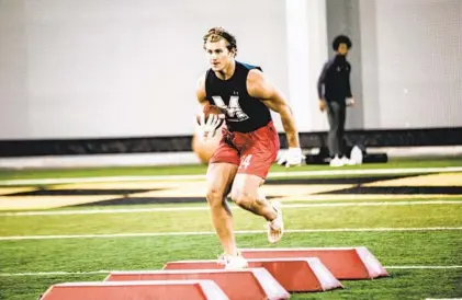  ?? MARYLAND ATHLETICS ?? Running back Jake Funk works through drills at Maryland’s pro day in Cole Field House on March 10.