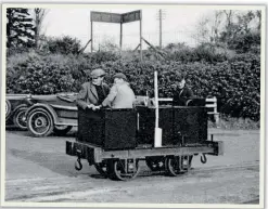  ?? TR ARCHIVES ?? A modern traction first for the sector! The Talyllyn steam fleet has been supplement­ed by diesel power from its early days. Tom Rolt is seen driving the line’s first No. 5 immediatel­y after it has been off- loaded at Tywyn Wharf on October 17, 1952. Built by David Curwen, it incorporat­ed the Ford model T engine and epicyclic transmissi­on previously in Tom’s narrowboat Cressy!
A week later, it was used to rescue No. 4 Edward Thomas, following a derailment on a ballast train. The rear of Tom’s Alvis is visible behind No 5.