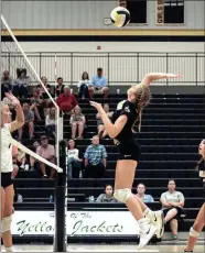  ?? TIM GODBEE / For the Calhoun Times ?? Calhoun’s Anna George goes up for a kill at the net during her team’s match against Coahulla Creek.