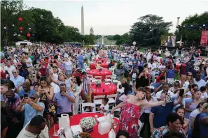  ?? The Associated Press ?? ■ Attendees listen as President Joe Biden speaks during an Independen­ce Day celebratio­n on the South Lawn of the White House on July 4, 2021, in Washington.