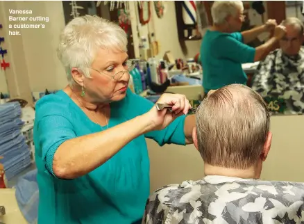  ??  ?? Vanessa Barner cutting a customer’s hair.