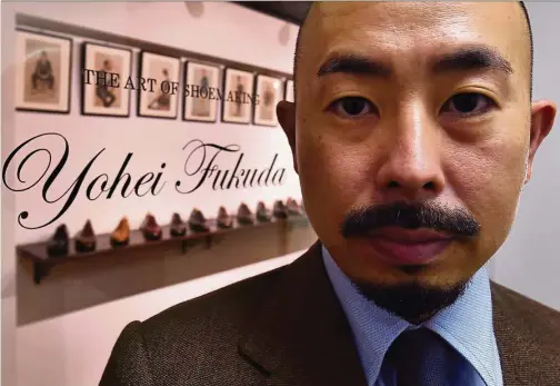  ?? — Photos: AFP/KAZUHIRO NOGI ?? Japanese master shoemaker Fukuda posing in front of his shop in Tokyo. When Fukuda left for England more than a decade ago to learn his trade as a master leather shoemaker, he could hardly have imagined that his native Japan would one day become a...