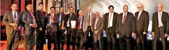  ?? ?? Officials from JF Packaging (Pvt) Ltd with the awards