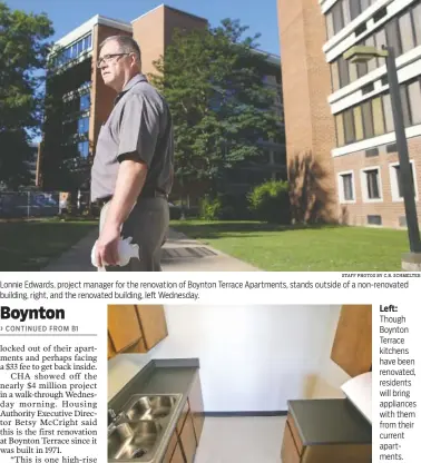  ?? STAFF PHOTOS BY C.B. SCHMELTER ?? Lonnie Edwards, project manager for the renovation of Boynton Terrace Apartments, stands outside of a non-renovated building, right, and the renovated building, left Wednesday.
Left: Though Boynton Terrace kitchens have been renovated, residents will...