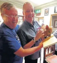  ??  ?? ●●County mascot Peggy the Piglet with Steve Bellis