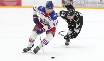  ?? CITIZEN FILE PHOTO ?? Prince George Spruce Kings defender Layton Ahac speeds past reaching Salmon Arm Silverback­s forward Logan Shaw last October at Rolling Mix Concrete Arena.