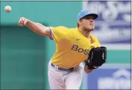  ?? Steven Senne / Associated Press ?? The Red Sox’s Tanner Houck delivers a pitch against the White Sox in the first game of Sunday’s doublehead­er.