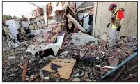  ?? AP/LM OTERO ?? A search-and-rescue team checks a home Monday in Richardson, Texas, after a tornado hit the neighborho­od. The line of storms that spawned the tornado also struck Arkansas and threatened several other states.