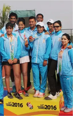 ?? — PTI ?? The men’s and women’s tennis teams pose after their clean sweep of gold and silver medals at the 12th South Asian Games in Guwahati on Thursday.
