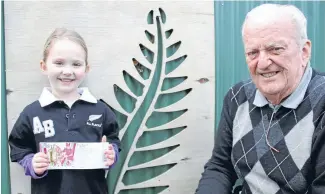  ?? Photo: Fairfax NZ ?? Lexi Dailey, 4, with grandfathe­r Robin Dailey, holds tickets to the Rugby World Cup. Lexi’s mum bought tickets which turned out to be part of a scam. Wellwisher­s have come up with tickets for the youngster.