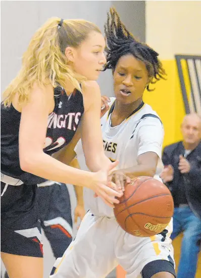  ?? KARL MERTON FERRON/BALTIMORE SUN ?? North County Knights forward Morgan Youngbar has the ball slapped from her hands by Divine Carter-Benson.