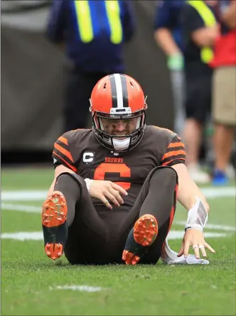  ?? TIM PHILLIS — FOR THE NEWS-HERALD ?? Baker Mayfield is knocked down during the Browns’ loss to the Titans on Sept. 8 at FirstEnerg­y Stadium.