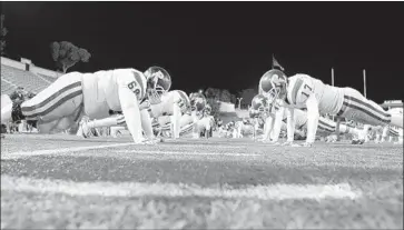  ?? Delirio Films ?? ROOSEVELT HIGH players warm up before facing Garfield in a rivalry depicted in “The All-Americans.”