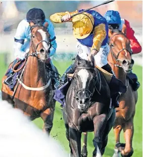  ??  ?? Arousing – ridden by Tom Marquand, centre – wins the British EBF Fillies’ Novice Stakes at Great Yarmouth Racecourse yesterday.
