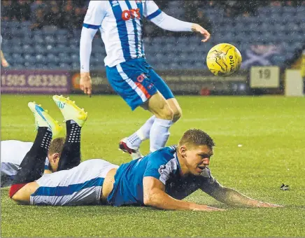  ??  ?? FALL GUY: Rangers’ Martyn Waghorn is sent tumbling on to the plastic pitch at Rugby Park
