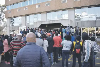  ?? Pictures: Emile Hendricks ?? RAGE BOILS OVER. Residents of Kimberley force their way into the municipal offices demanding the suspension of the Sol Plaatje municipal manager and chief financial officer yesterday over allegation­s of corruption.