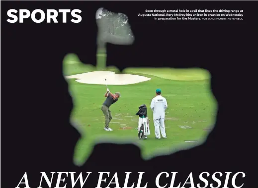  ?? ROB SCHUMACHER/THE REPUBLIC ?? Seen through a metal hole in a rail that lines the driving range at Augusta National, Rory McIlroy hits an iron in practice on Wednesday
in preparatio­n for the Masters.