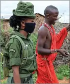  ??  ?? RANGERS: Members of the Maasai tribe in Kenya head out on patrol