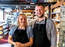  ??  ?? Mother and son, Carole and Rowan Bardon in the ancient chemist’s shop, where medicines have been replaced by traditiona­l sweets.