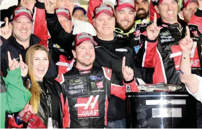  ??  ?? DAYTONA BEACH: Kurt Busch, driver of the #41 Haas Automation/Monster Energy Ford, celebrates in Victory Lane after winning the 59th Annual DAYTONA 500 at Daytona Internatio­nal Speedway on Sunday in Daytona Beach, Florida.—AFP