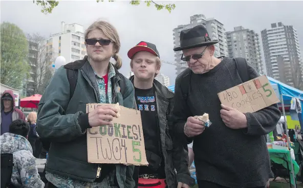  ?? — THE CANADIAN PRESS FILES ?? Cannabis cookie sellers wait for customers during the 4-20 cannabis culture celebratio­n at Sunset Beach last year.