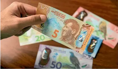  ??  ?? New Zealand’s newer $5 note was named Banknote of the Year in an internatio­nal competitio­n last year.