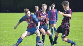  ??  ?? Dundee West U/19 (lighter blue and red) squared off with Coupar Angus U/19 at Charlotte Street last weekend.