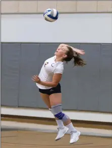  ?? Eddy Martinez/For The Signal ?? College of the Canyons’ Elizabeth Gannon serves in a game against Irvine Valley College. The Cougars lost 3-0.